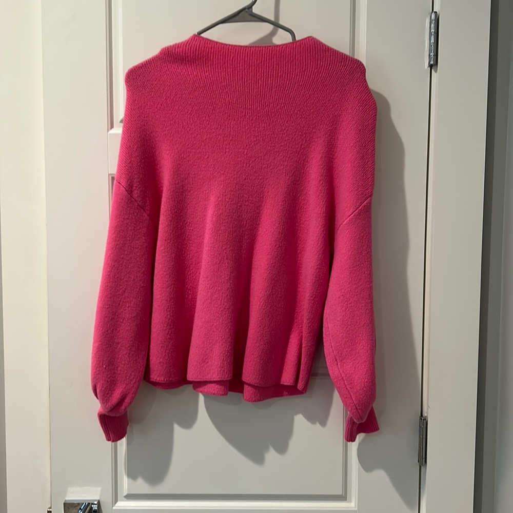 Pink sweater with rounded neckline